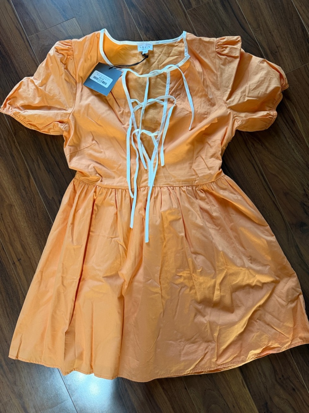 Orange Short Sleeve Dress with White Trim from Josie’s Boutique. NWT